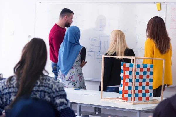 Female Professor Holding Lecture to Multi Ethnic Group of Studen