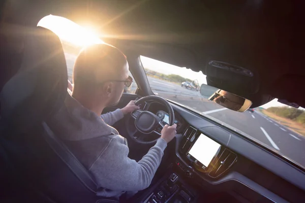 Young man driving in the modern car — Stock Photo, Image