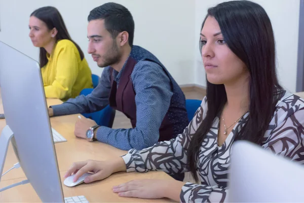 Group of  university IT technologies students working on practic