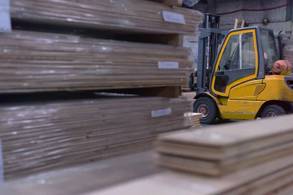 Timber Flooring Factory. Pile of cut wood in factory storage war