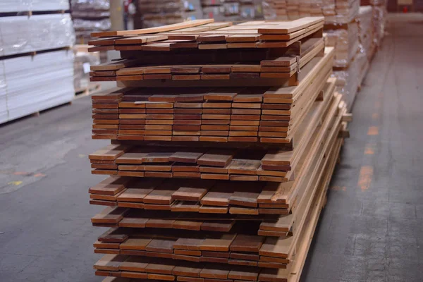 Timber Flooring Factory. Pile of cut wood in factory storage war