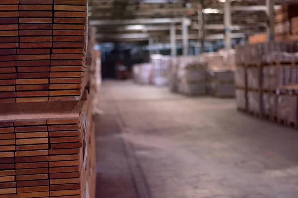 Timber Flooring Factory. Pile of cut wood in factory storage war