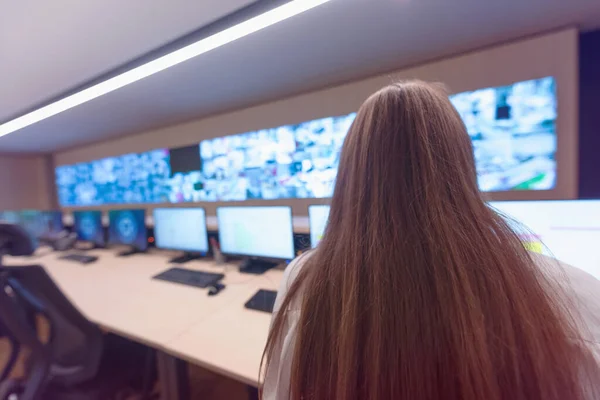 Security guard monitoring modern CCTV cameras in surveillance ro — Stock Photo, Image