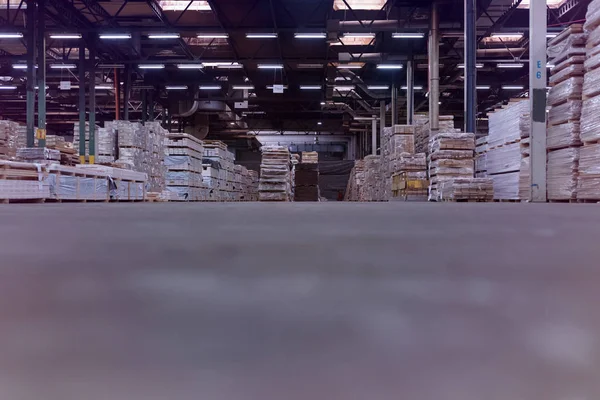 Timber Flooring Factory. Pile of cut wood in factory storage war