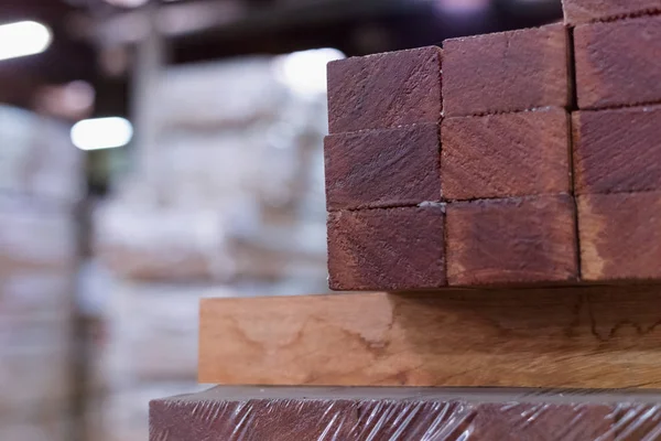 Timber Flooring Factory. Pile of cut wood in factory storage war