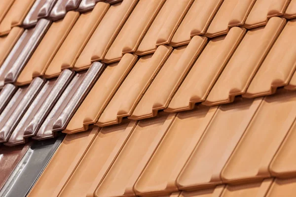 types of red tiles for roof  to cover the house, note shallow depth of field