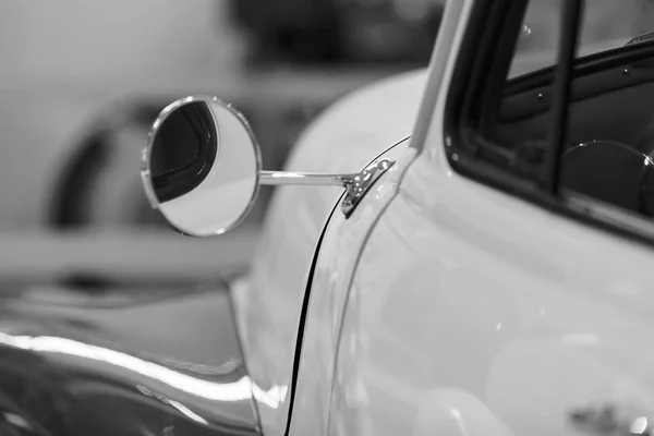 rearview mirror on the motor vehicle, note shallow depth of field