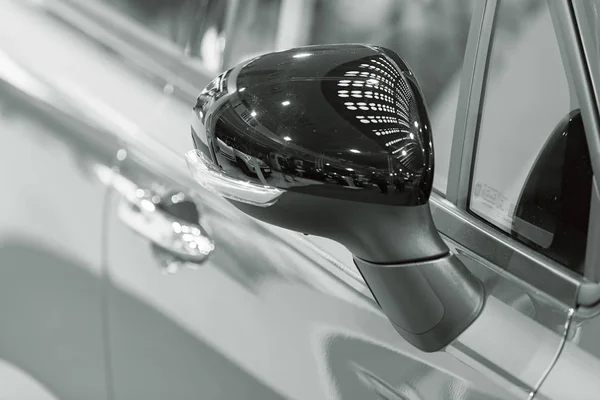 rearview mirror on the motor vehicle, note shallow depth of field