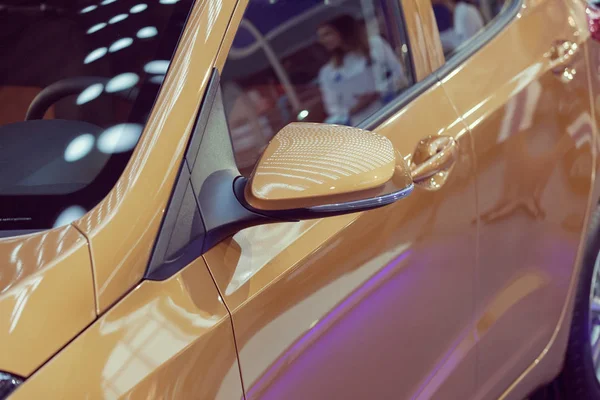 rearview mirror on the motor vehicle, note shallow depth of field