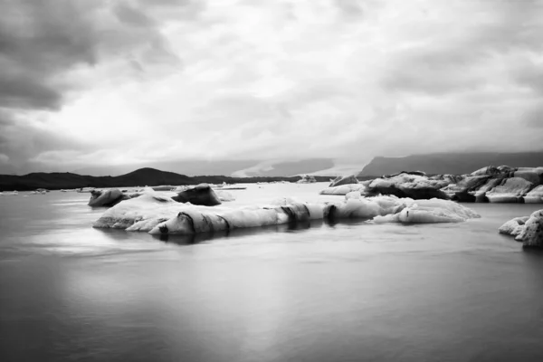 Jokulsarlon glacier lagoon in Iceland. Long exposure shot makes, black and white, vintage — Φωτογραφία Αρχείου