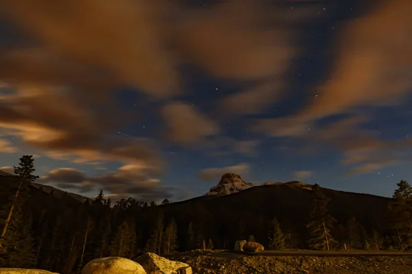 Dark mountain. backgrounds night sky with stars and clouds. Spring Creek, Canada