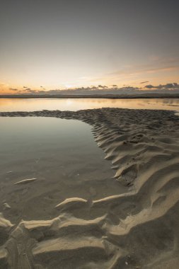 Tranquil colorful sunset over sea, viewed from the dutch coast. The Netherlands