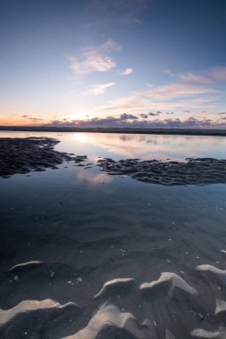 Tranquil colorful sunset over sea, viewed from the dutch coast. The Netherlands