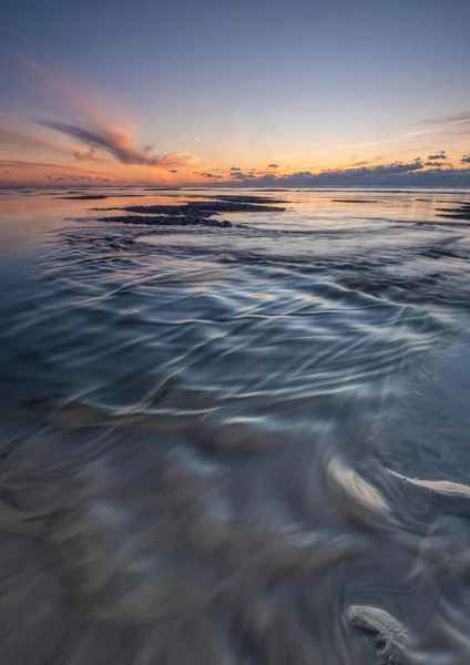 Tranquil colorful sunset over sea, viewed from the dutch coast. The Netherlands — 图库照片