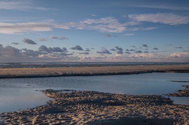 Tranquil colorful sunset over sea, viewed from the dutch coast. The Netherlands