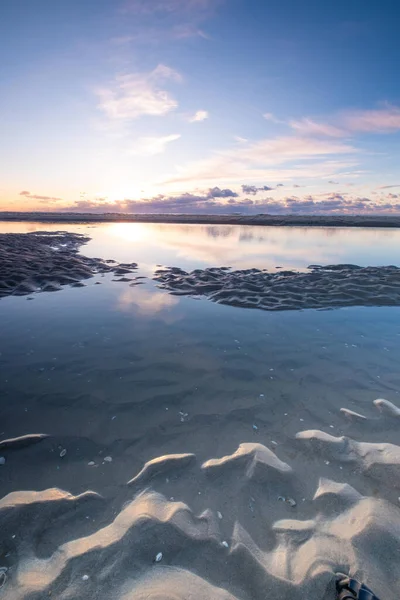 Tranquil colorful sunset over sea, viewed from the dutch coast. The Netherlands — 图库照片