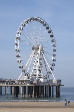 The Hague, Februari 18 2019: Scheveningen, The Hague, The Netherlands. Ferris wheel and a bungy tower on the pier of Scheveningen, The Hague. The Netherlands
