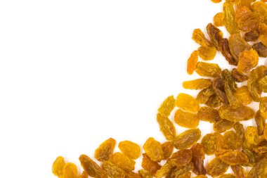 Beyaz zemin üzerine sarı kuru üzüm.