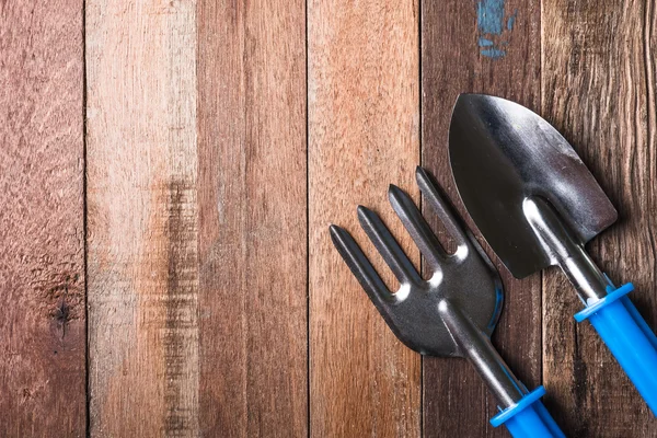 Top view of  Garden tools on wooden table background. Free space for text — Stock Photo, Image