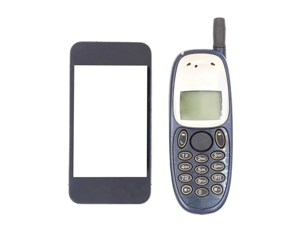 Новый смартфон со старым мобильным телефоном на белом фоне — стоковое фото