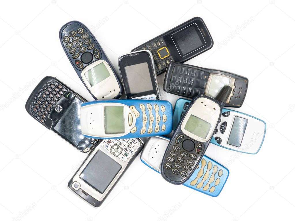 Top view of Old mobile phones on white background