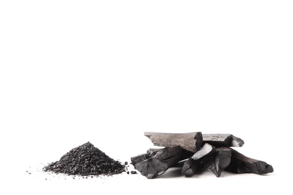 Charcoal and powder (activated carbon) on white background. Free space for text — Stock Photo, Image