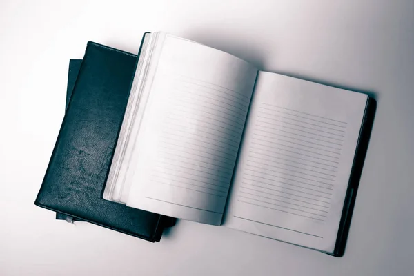 Top view of an open notebook on white background. Vintage tone — Stock Photo, Image