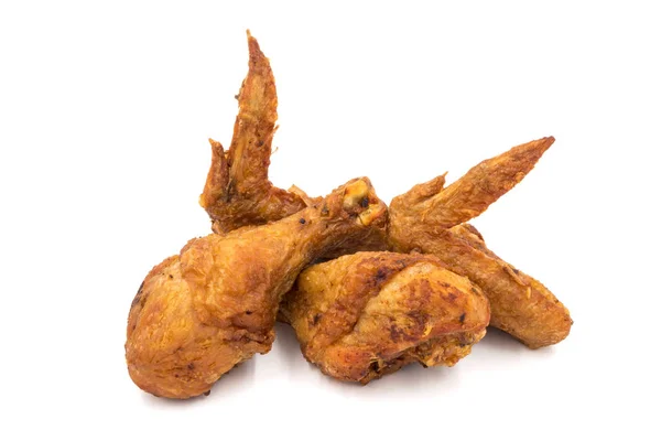 Fried chicken legs and wings on a white background. — Stock Photo, Image