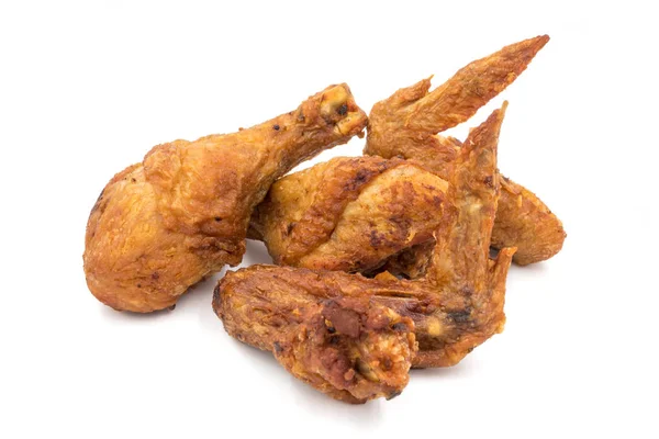 Fried chicken legs and wings on a white background. — Stock Photo, Image