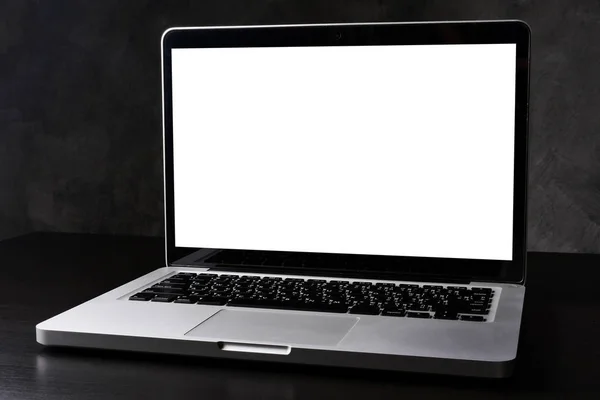 Silver laptop computer with white screen on dark background. — Stock Photo, Image