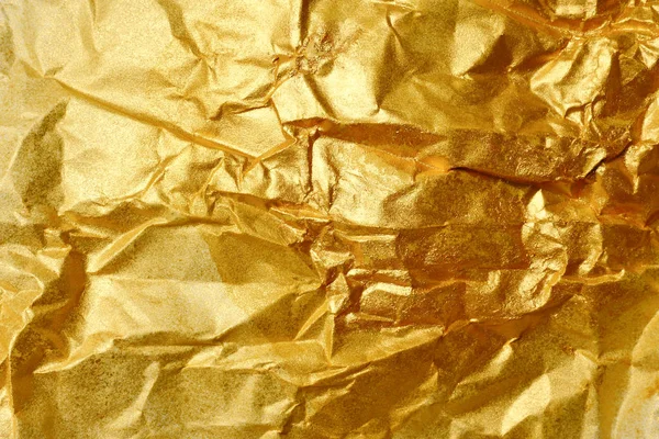 Абстрактный текстурный фон из морщинистой золотой бумаги — стоковое фото