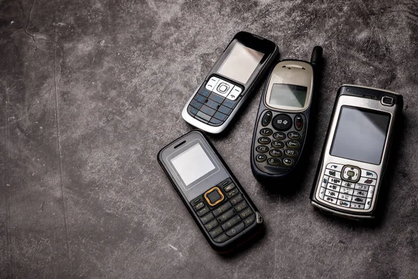 Many Obsoleted Cellphones Grunge Background — Stock Photo, Image