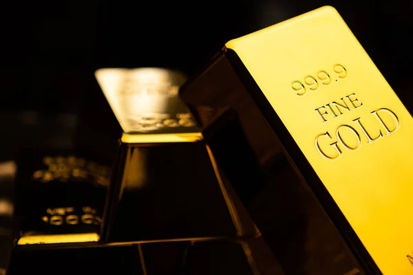 Close up of gold bars on black bacground. financial concept