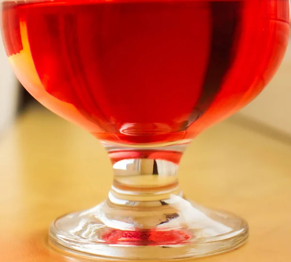 Big Glass Red Cognac Blurred Background — Stok fotoğraf