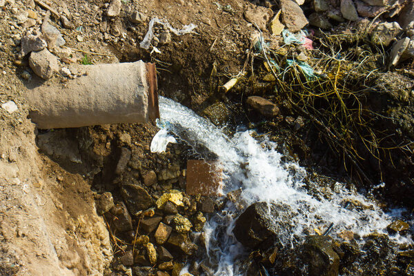 water flowing from a dirty pipe