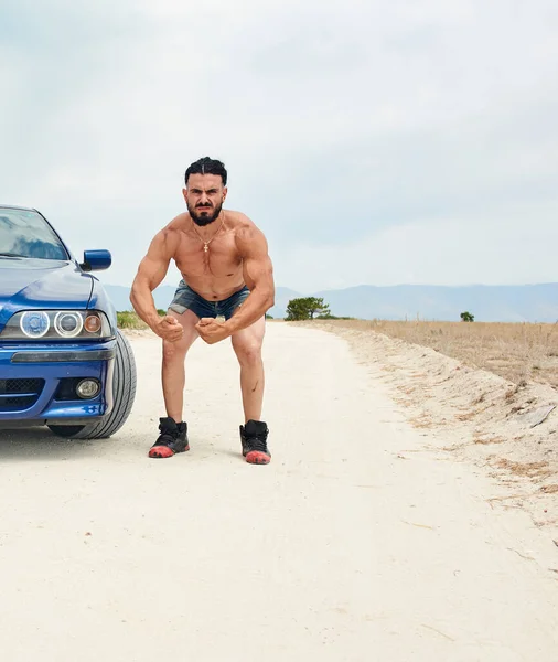 Young Sports Man Posing Blue Sports Car Beach — Stock Photo, Image