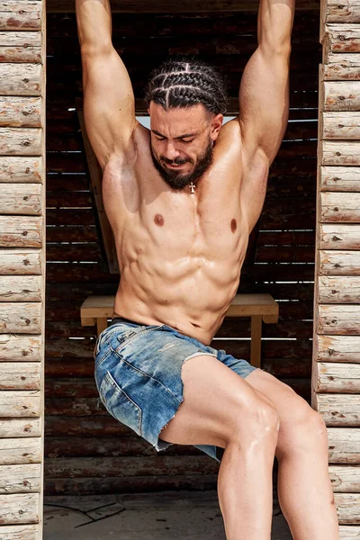 Muscular Young Man Posing Wooden House — Stock Photo, Image