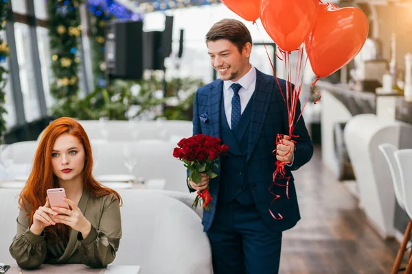 Young and beautiful lady waiting man in restaurant — 스톡 사진