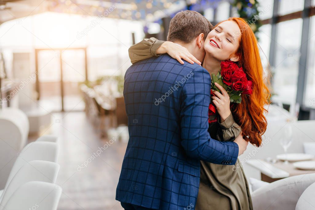 lovely redhaired lady and handsome guy on a date