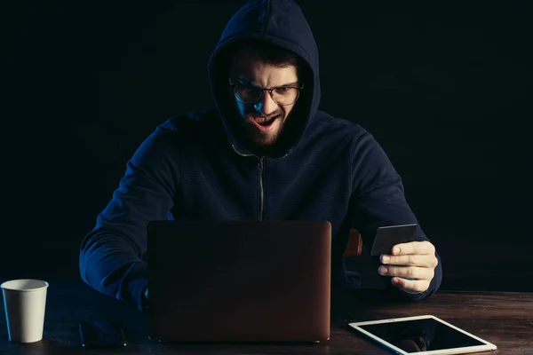 excited surprised hacker man isolated in dark space