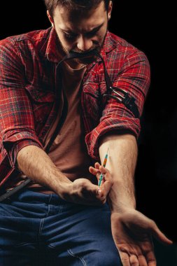 young male doing pricks intravenously