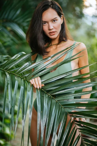 Brunette woman in wild tropical rainforest — Stok fotoğraf