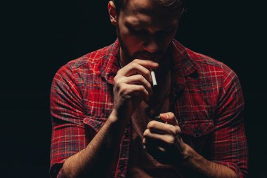 young man suffer from bad habit - smoking