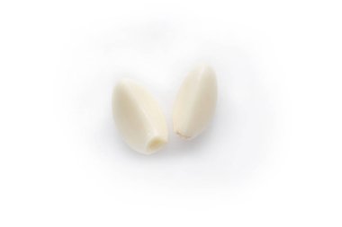 peeled garlic clove divided into two parts isolated on white background