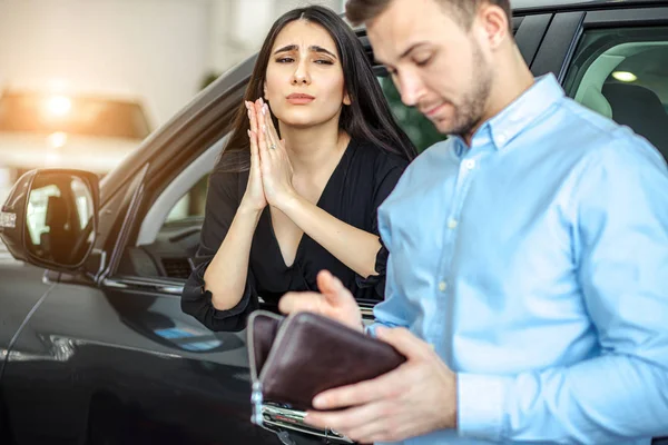 Wife begs her husband to buy new car — Stok fotoğraf