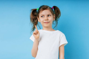 cute little child girl isolated over blue background