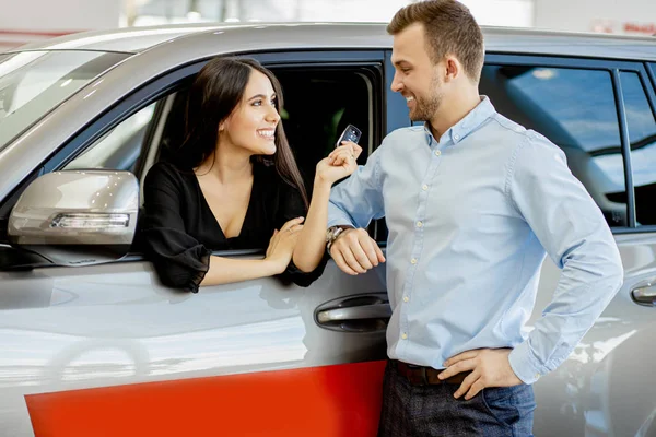 Happy married couple with their new purchased car — Stok fotoğraf