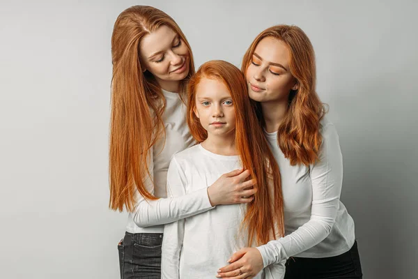 Cute caucasian sisters with red hair isolated — Stockfoto