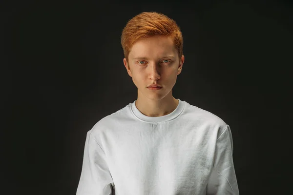 Portrait of serious redhead guy isolated over black background — 스톡 사진