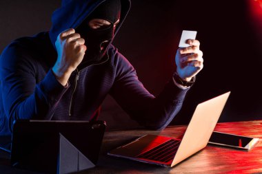 anonymous hacker man with laptop clipart